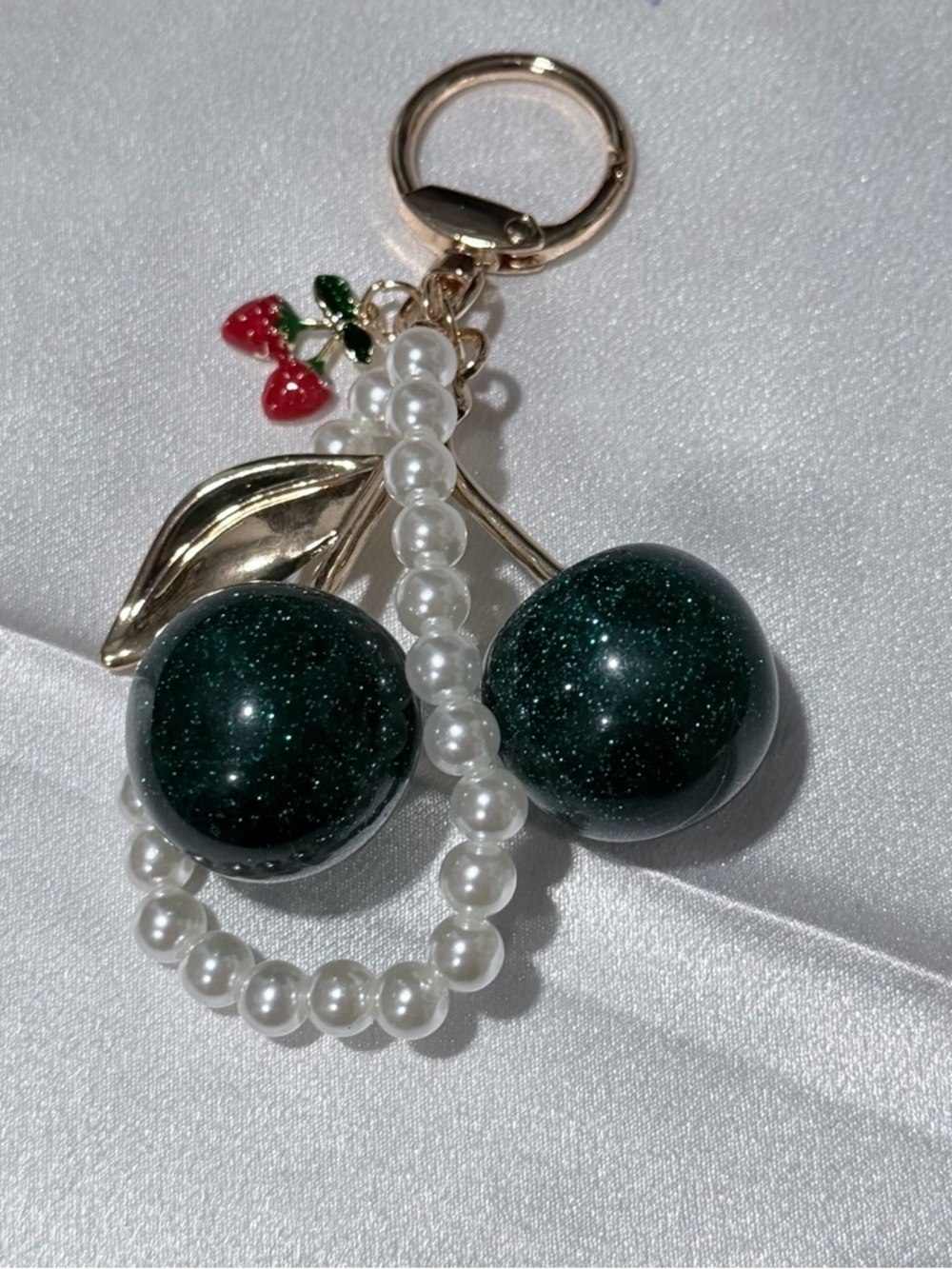 Green cherry charm with gold tone